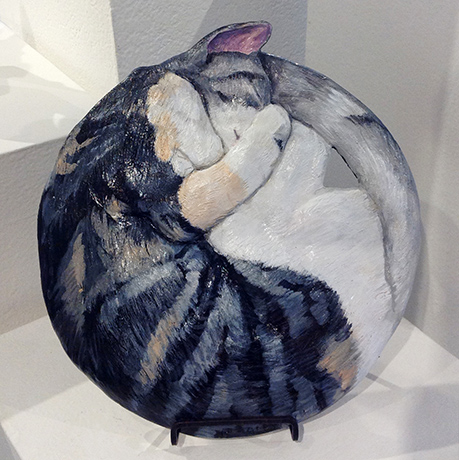 Wall hanging of sleeping cats