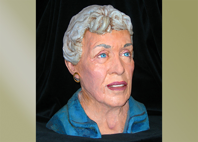 Sculpture of a woman painted realistically