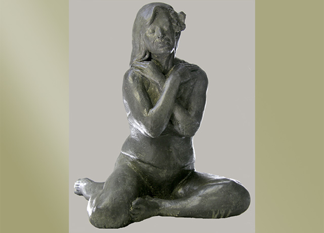Sculpture of a seated female